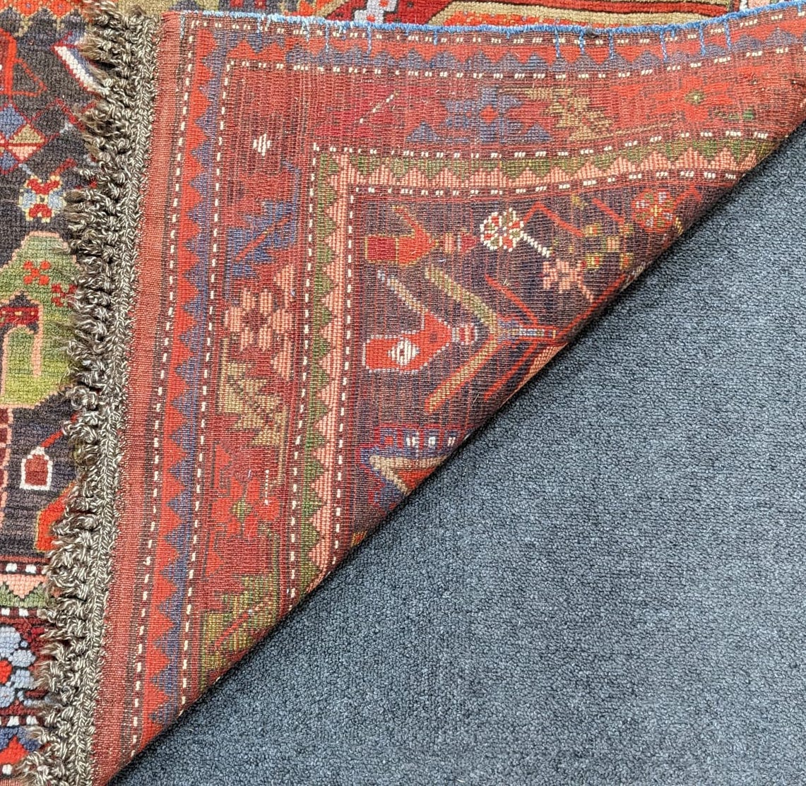 An antique Goradis blue ground rug 220 x 125cm
